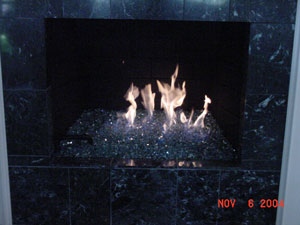fire in glass fireplace design